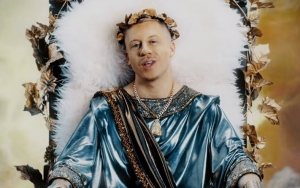 Macklemore Is a God in 'How to Play the Flute' Trippy Music Video