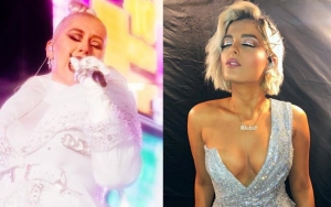 Christina Aguilera, Bebe Rexha Withstand Torrential Downpour for New Year Rockin' Eve 