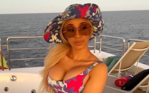 Cardi B Blames 'Voice in Her Head' for Her Strange Expression During Conversation