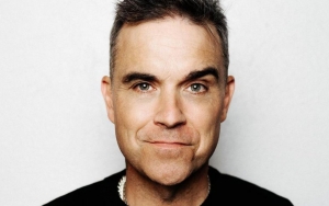 Robbie Williams Readying New Songs Under Different Moniker