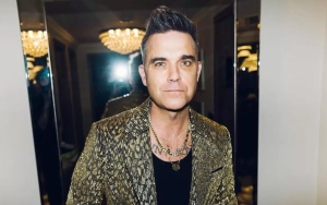 Robbie Williams Reveals Whether He's Ever Kissed His Take That Bandmates