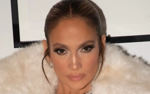 Jennifer Lopez Flashes Abs in Stunning Green Suit in New Photos