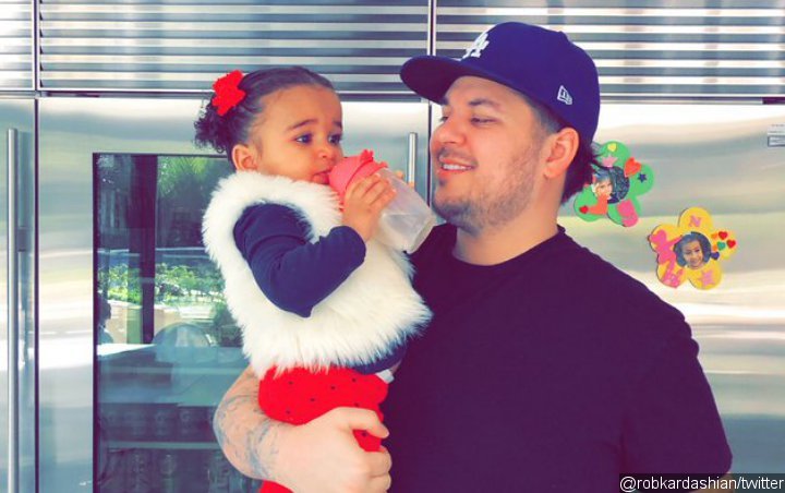 Rob Kardashian Snuggles to Daughter Dream in Rare Appearance at Family's Christmas Celebration