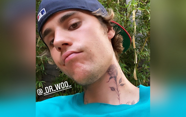 Justin Bieber Debuts New Rose Tattoo
