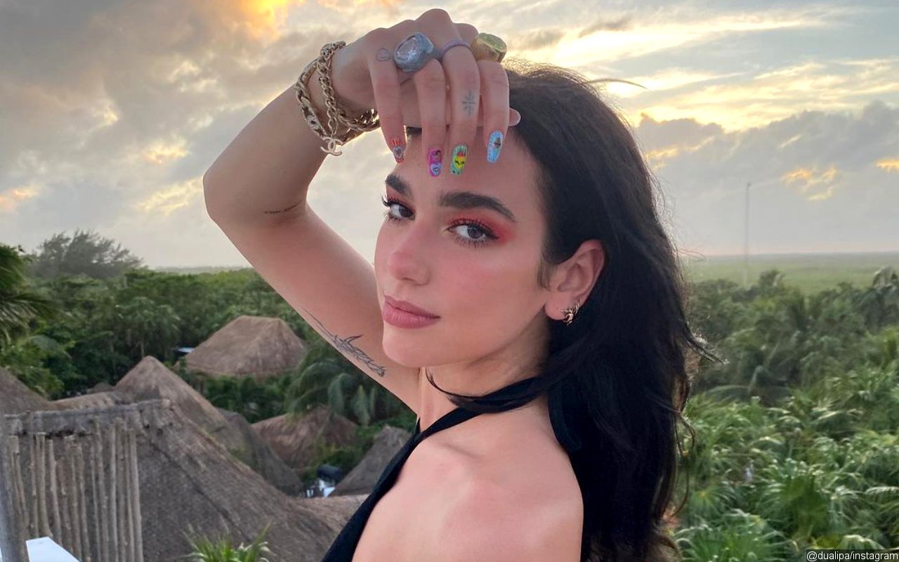 Dua Lipa Shrugs Off Pregnancy Rumors Caused by Cryptic Baby Emoji Caption