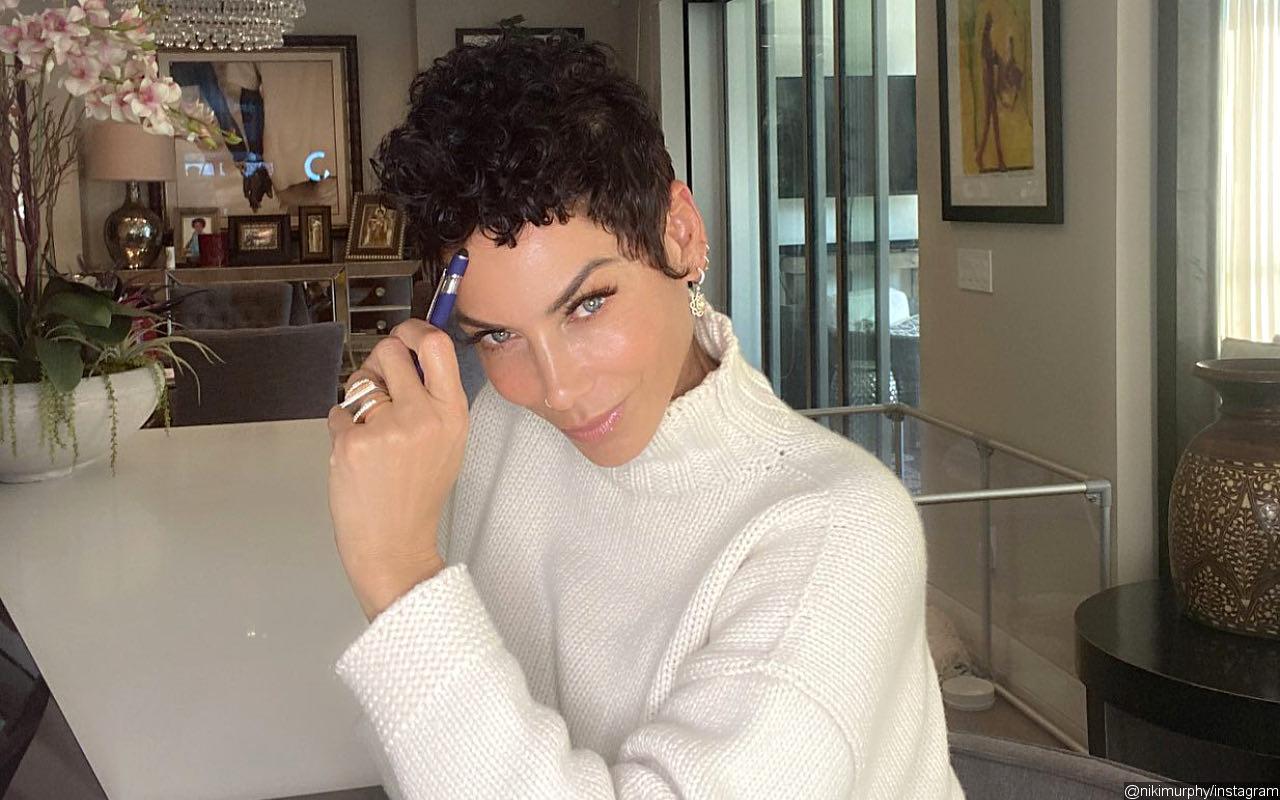 Nicole Murphy Appears to Mock Homeless Person