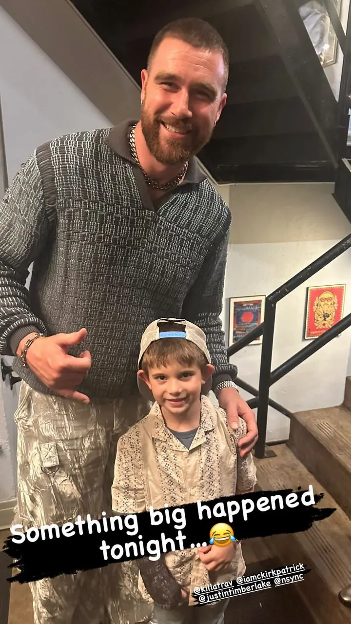 Travis kelce poses with Chris Kirkpatrick's son