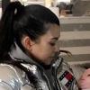 Kourtney Kardashian Cradles Baby Doll While Covering Her Belly in New Pic