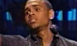 Chris Brown urges fans to donate during his set.