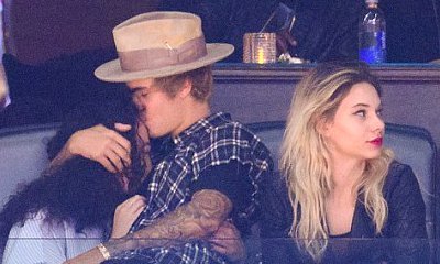 Justin Bieber Kisses Ashley Moore and Sits on Her Lap at Clippers Game