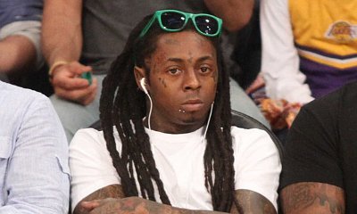 Lil Wayne Lashes Out at Fan Who Throws a Beer at Him During His Concert