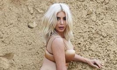 Kim Kardashian Looks Naked in Skin-Colored Bodysuit and Stockings for Booklet Photo Shoot