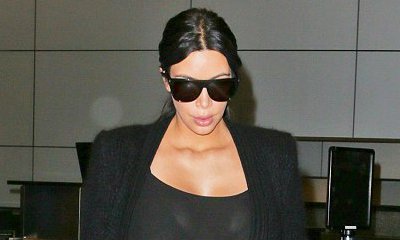 Kim Kardashian Wears a Sheer Catsuit After Her Quest for Pregnancy Wardrobes in Paris