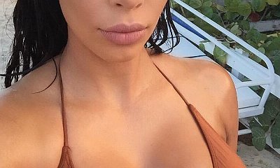 Kim Kardashian Shows 'Milk Bottle' Boobs Before Posting Old Selfie With Short Hair
