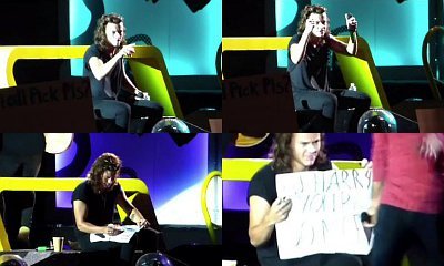 Video: Harry Styles Fixes Grammar on a Fan's Sign During Concert