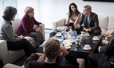 George Clooney and Wife Amal Discuss Refugee Crisis With Angela Merkel in Berlin