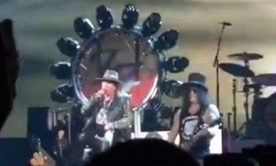 Axl Rose Borrows Dave Grohl's Throne for Guns N' Roses Concert After Breaking His Foot