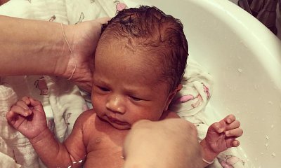Chrissy Teigen Posts First Photo of Daugher Luna Taking Bath. See the Adorable Pic!