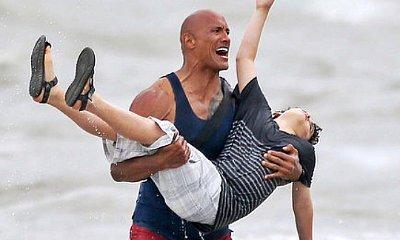 'Baywatch': See The Rock Come to a Boy's Rescue in New Set Photo