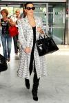 Kim Kardashian Caught Scott Disick and Rob Snuggling During Airport Nap