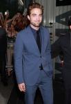 Robert Pattinson All Smiles for First Public Appearance at 'Cosmopolis' Premiere