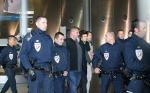One Direction's Harry Styles Escorted by Police at Paris Airport