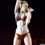 Miley Cyrus Motorboats Dancer's Cleavage, Appears in Underwear