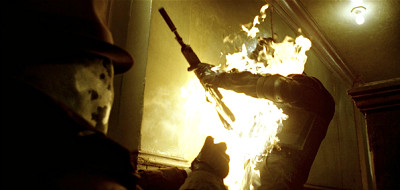 Rorschach burns a SWAT member to escape imprisonment