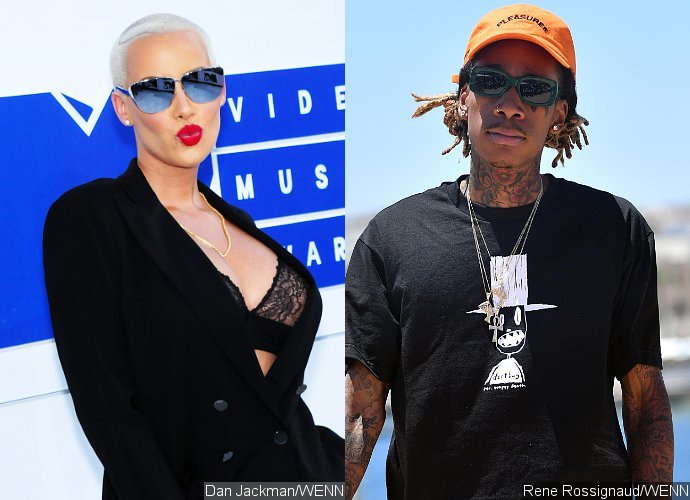 Amber Rose and Wiz Khalifa Are Feuding on Twitter After Her Threesome Confession