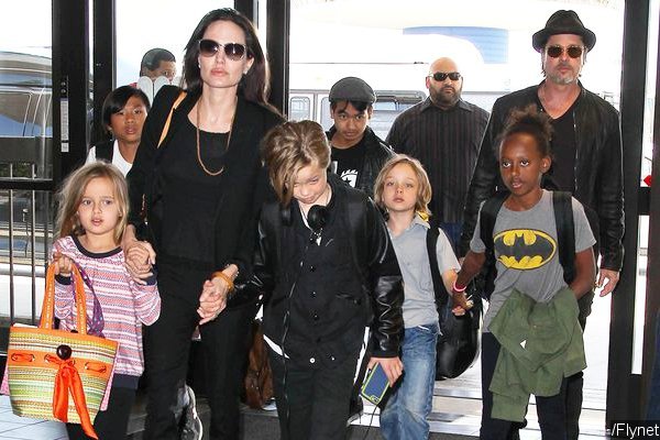 Angelina Jolie, Brad Pitt and Their Six Children Fly in Economy Class