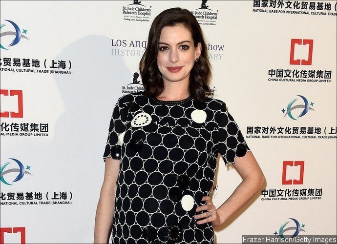 Anne Hathaway Shows Off Baby Bump on Red Carpet for First Time