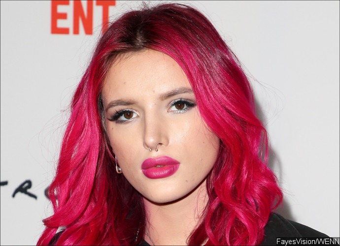 Bella Thorne Flaunts Perky Butt in Skimpy Bikini While Eating Burger