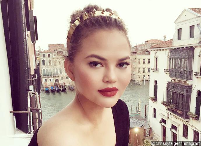 Braless Chrissy Teigen Almost Spills Out of Her Plunging Dress in Italy