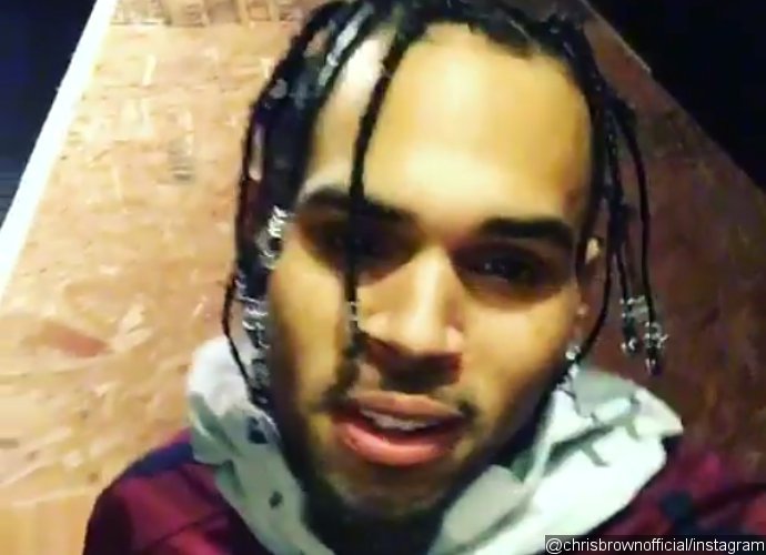 chris brown shows off hair weave