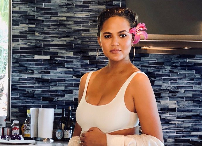 Chrissy Teigen Flaunts Growing Baby Bump in Sexy Bodysuit - See the Pics!