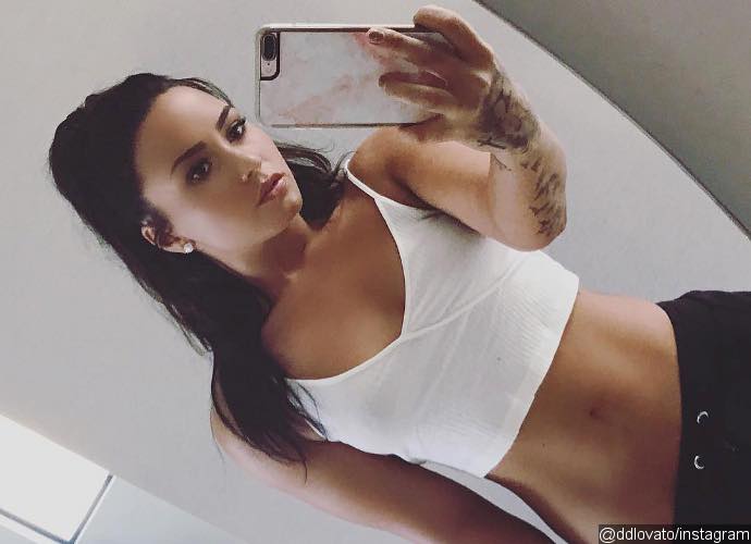 Demi Lovato Pulls Down Her Pants to Show Off Her Toned Midriff