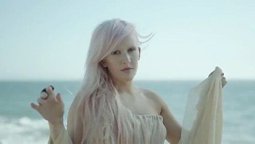 Ellie Goulding in a  flowing white dress in the music video for 