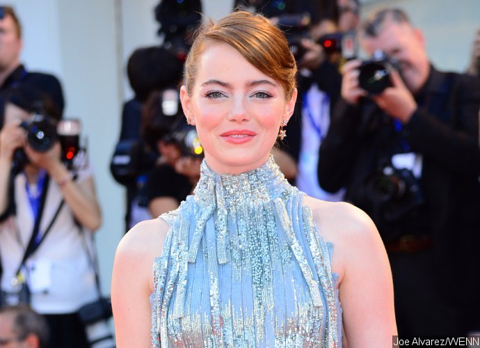 Emma Stone Shines in Silver at 'La La Land' Venice Premiere