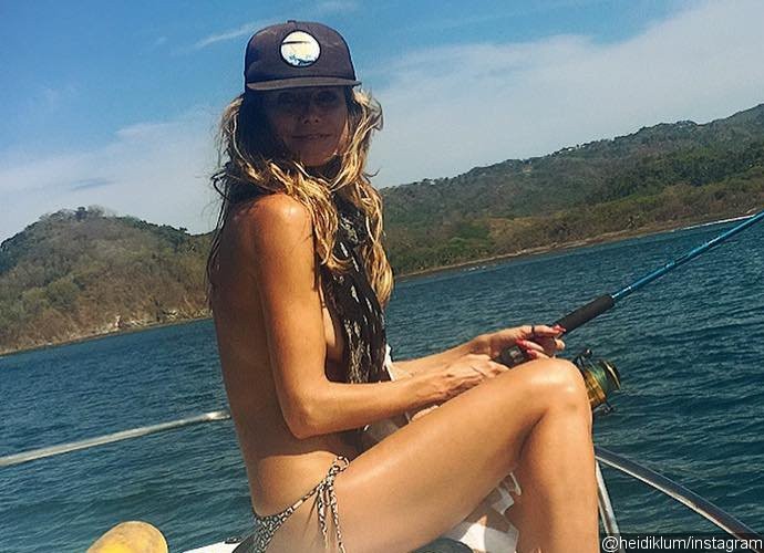 Racy Vacation! Heidi Klum Ditches Top While Fishing in the Caribbean