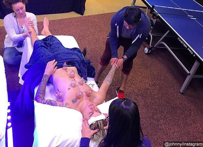Justin Bieber Gets Massaged by Three People at Once in New Pic