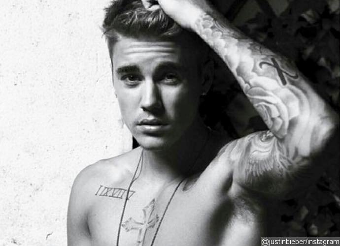 Justin Bieber Shares Sexy Photo Amid Report He Threatens to Sue Over His Naked Photos