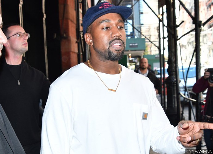 Kanye West Is a 'Wallflower' at Kardashian Christmas Party