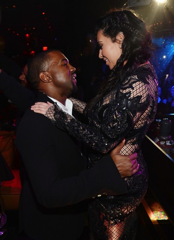 http://www.aceshowbiz.com/images/news/kanye-west-kissing-kim-k-new-year-s-eve-party-vegas-02.jpg
