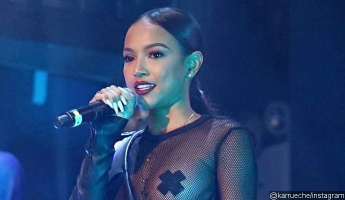 Karrueche Tran Lets Her Boob Hang Out in Mesh Outfit