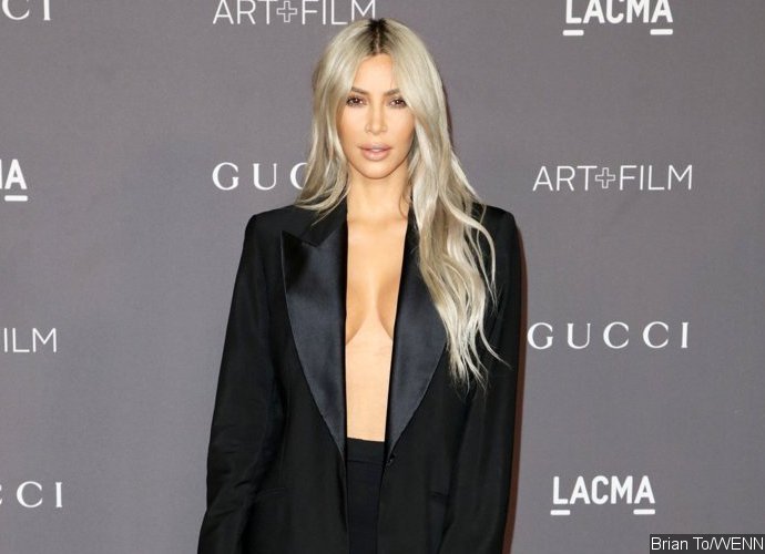 Kim Kardashian Breaks Her 'No Jewelry' Rule by Wearing Diamond Grill on IG, Puts on a Busty Display