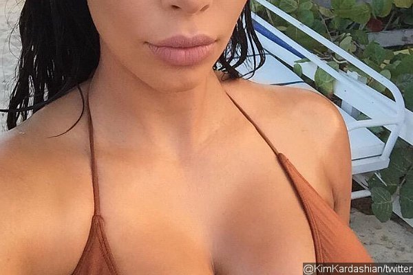 Kim Kardashian Shows 'Milk Bottle' Boobs Before Posting Old Selfie With Short Hair