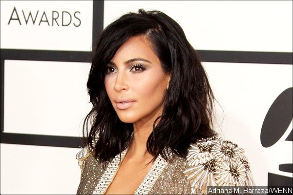 Kim Kardashian Threatens to Sue Photo Agency Over Intrusive Nude Pool Photos
