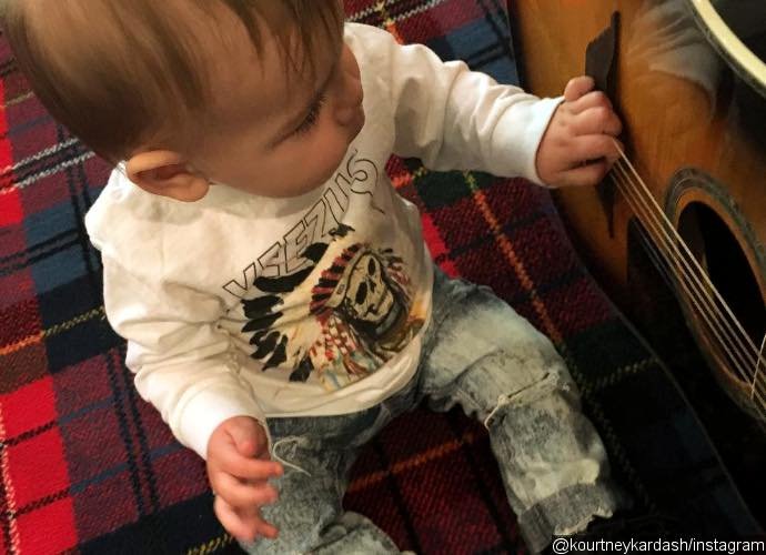 Kourtney Kardashian Shares Cute Photo of Baby Reign as Rock Star Wannabe