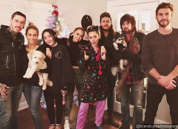 Liam Hemsworth Joins Miley Cyrus and Her Family for Early Christmas Party