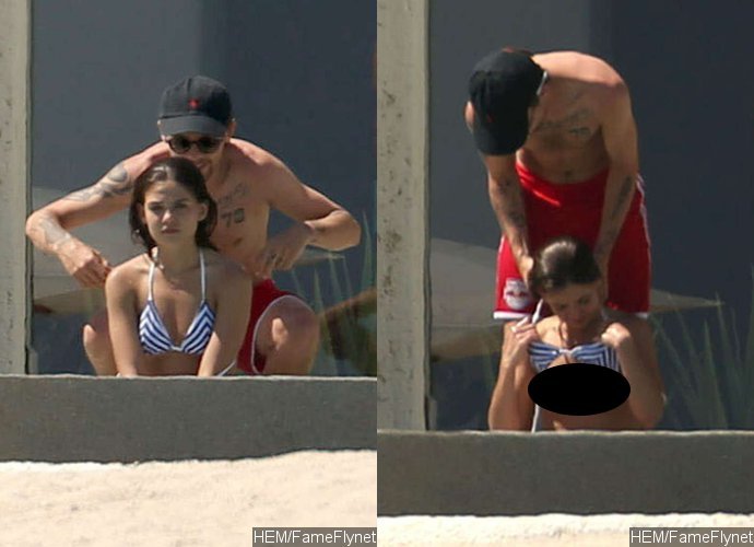 Louis Tomlinson Pictured Helping Undress His Girlfriend, Angry About Leaked Topless Pics